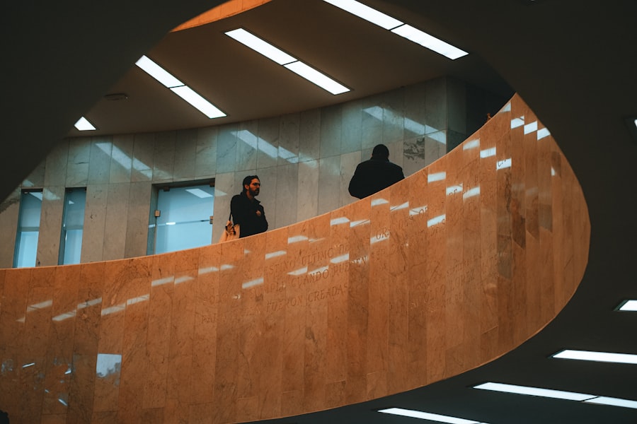 Two people on a modern spiral staircase