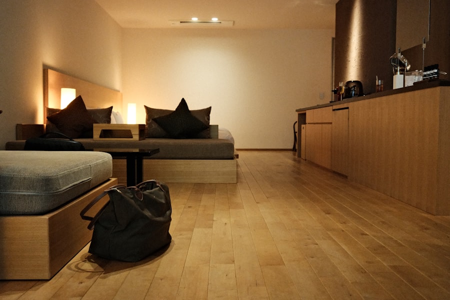 Modern room with wooden floor, bed, and kitchen counter