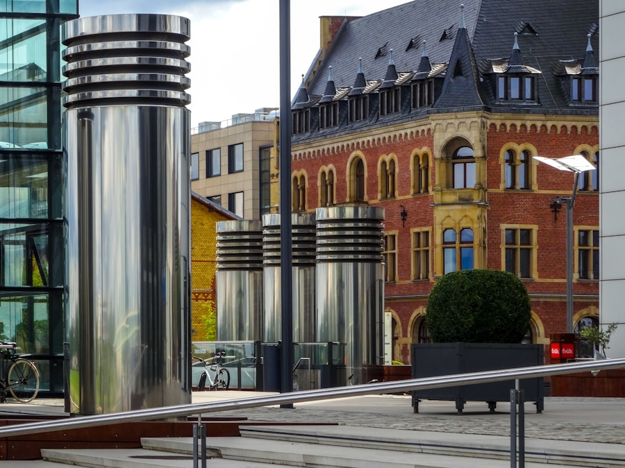 Modern stainless steel sculptures outside brick building