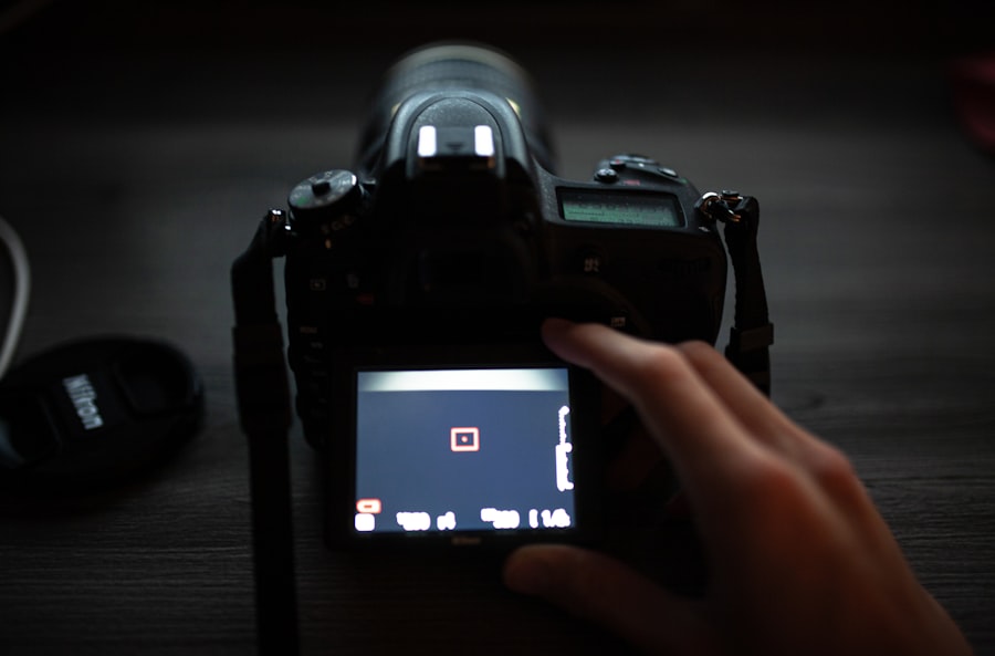 a person taking a picture of a camera
