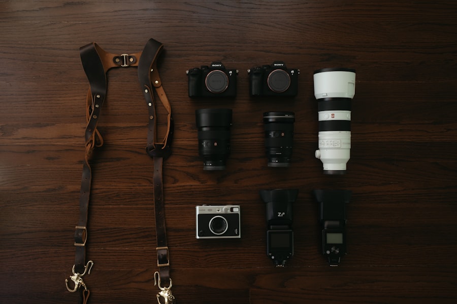 A wooden table topped with cameras and other accessories