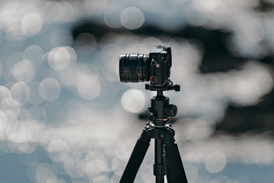 black dslr camera on tripod