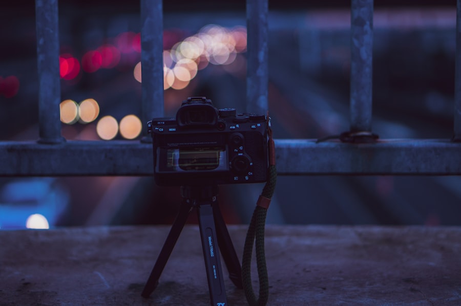 black dslr camera on tripod