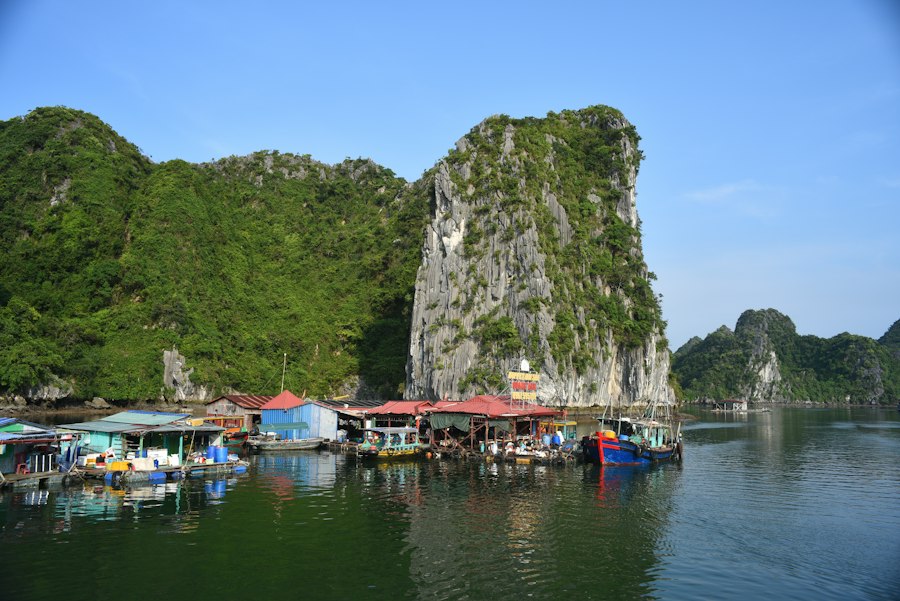 Floating village nestled among limestone karsts