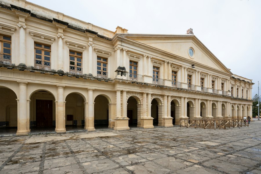 Elegant colonial building with arched walkways and columns