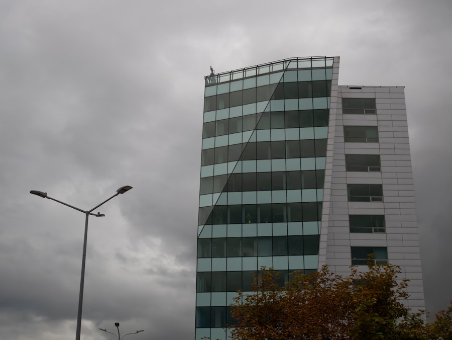 a very tall building sitting next to a street light