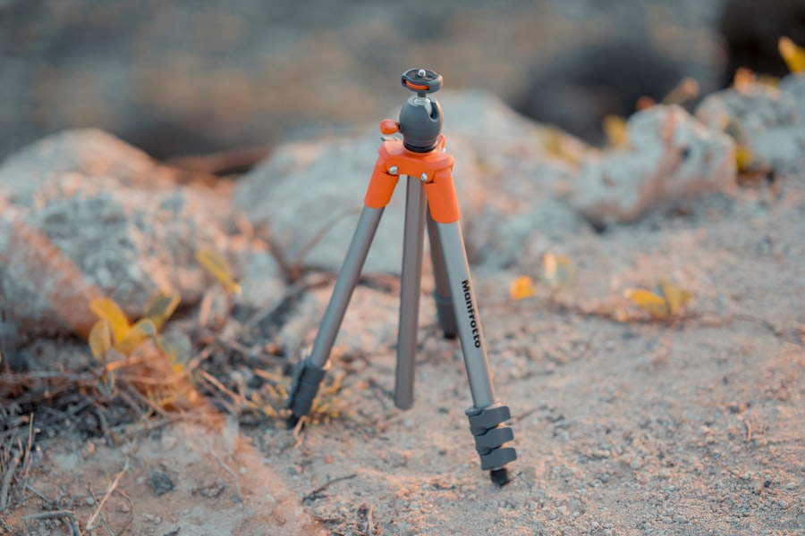 silver and red Monfrotto tripod