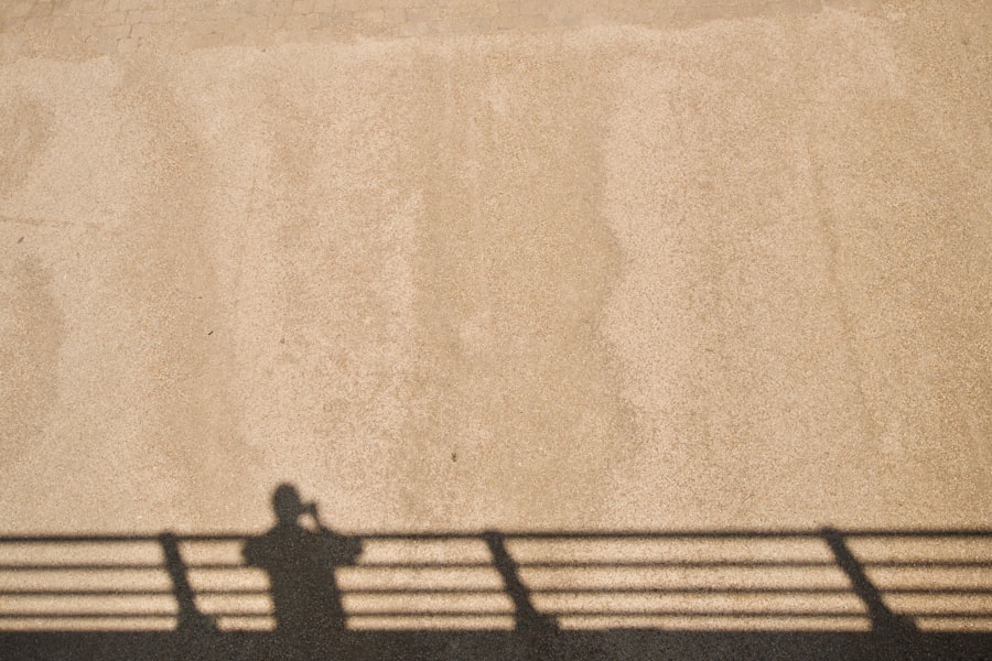 person taking picture of the shadow