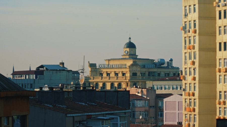 City buildings with a dome structure at sunset.