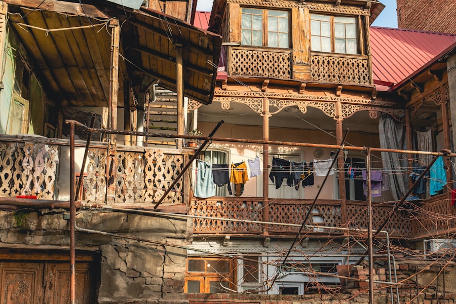 a balcony with clothes hanging on a clothes line