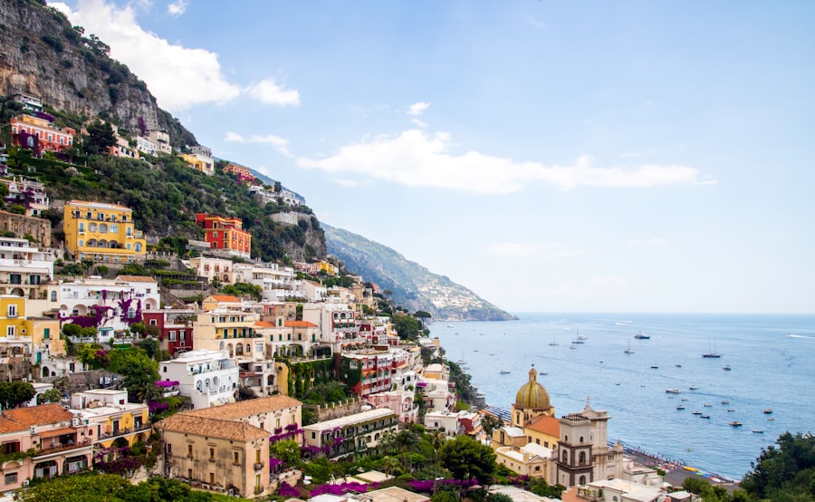 houses on mountain near body of water