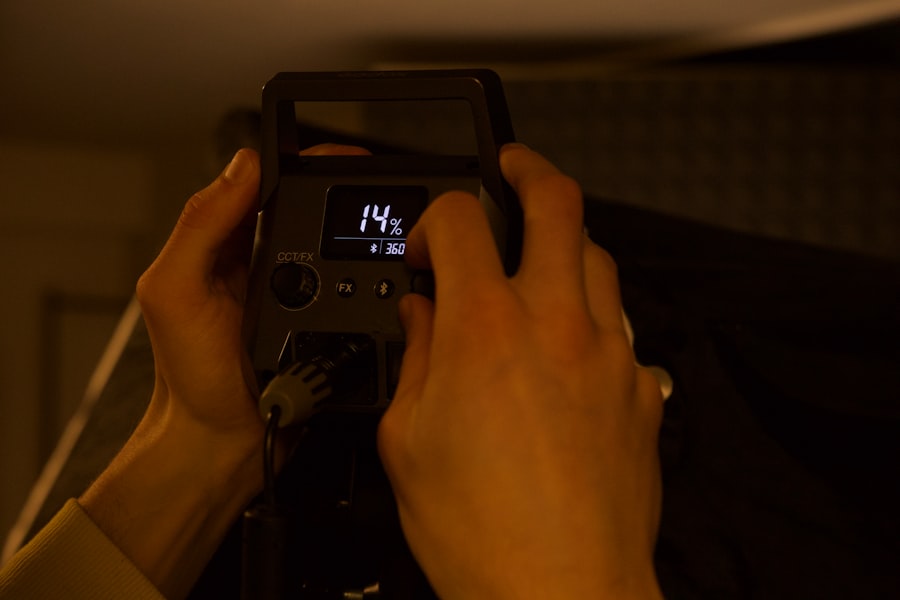 Hands are adjusting settings on a device