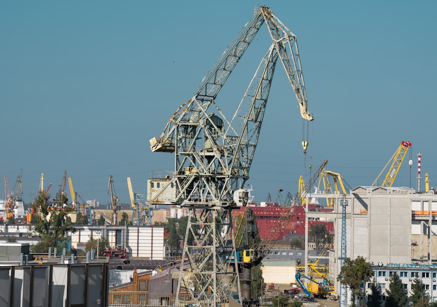 Large industrial cranes against a clear blue sky