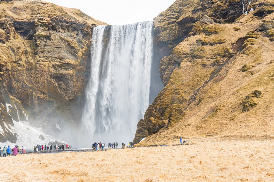 A powerful waterfall cascades down a rocky cliff face.