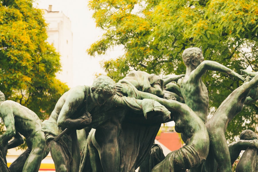 a statue of a group of people with trees in the background