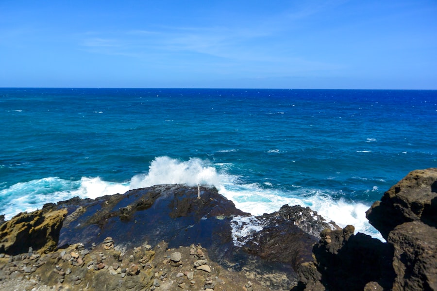 a view of the ocean from a rocky shore
