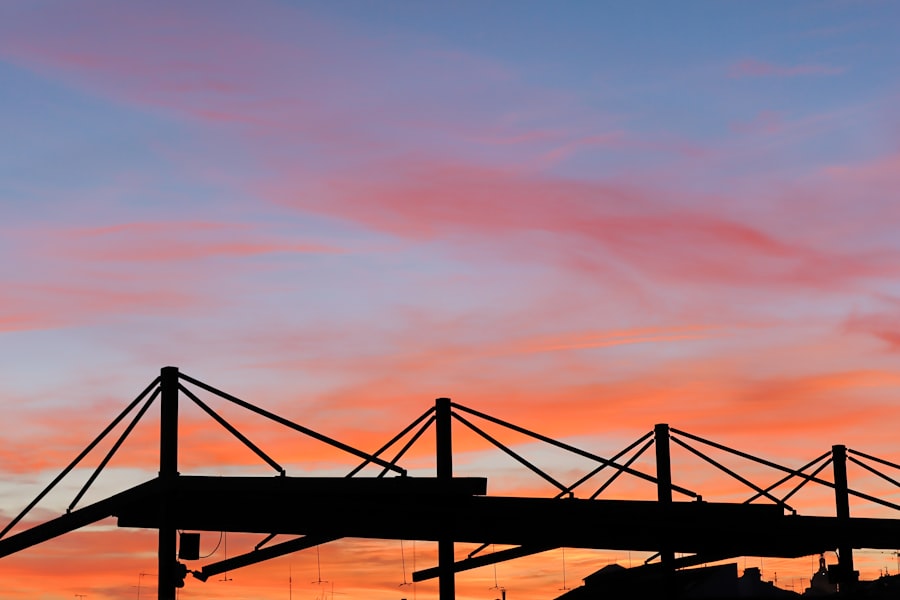 Sunset sky silhouettes a structure.