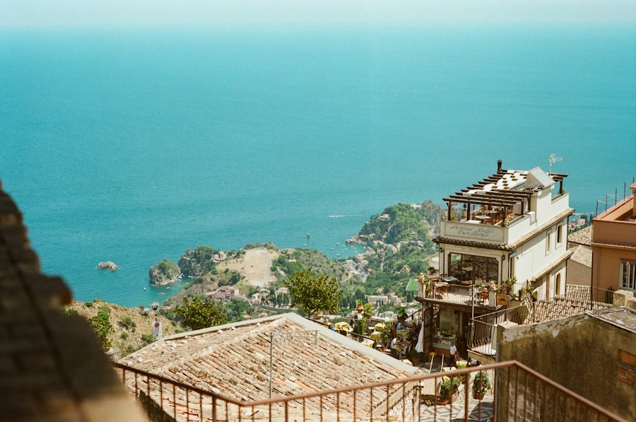 Coastal town with buildings overlooking the turquoise sea