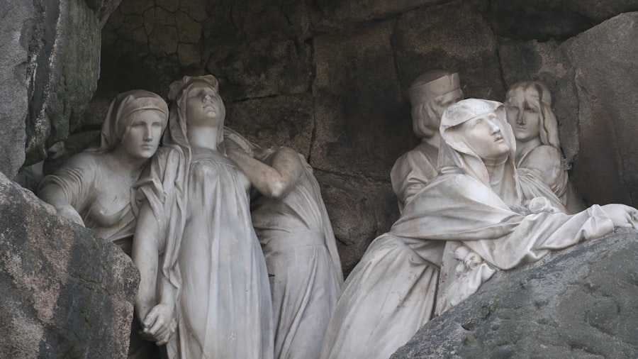 A group of statues sitting on top of a rock