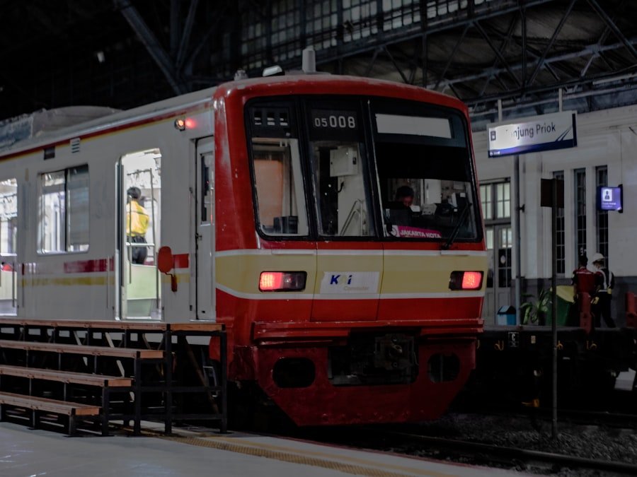a red and white train pulling into a train station