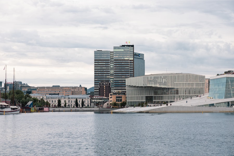 Modern buildings on a waterfront under cloudy skies