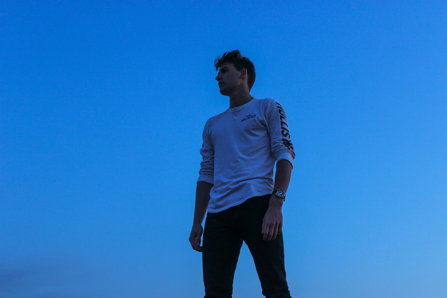 male model in a white shirt and black pants