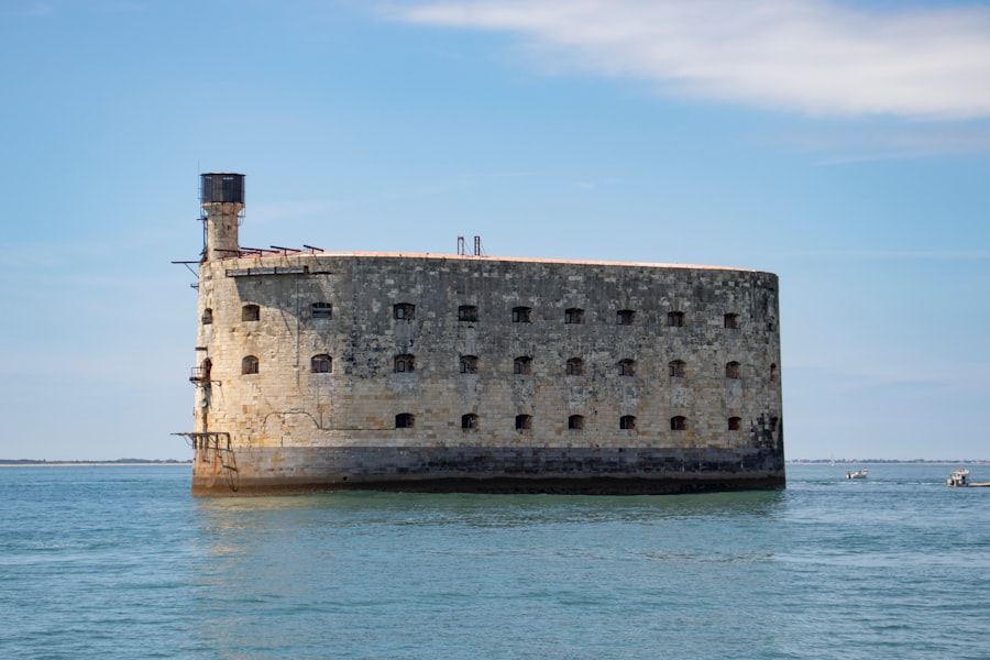 brown concrete building near body of water during daytime