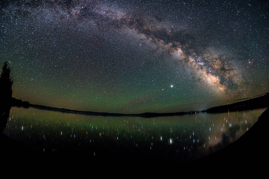 the night sky is reflected in the water