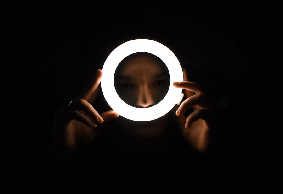 a person holding a light up in the dark