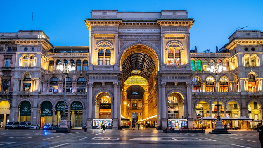 Grand archway of illuminated historic building at dusk
