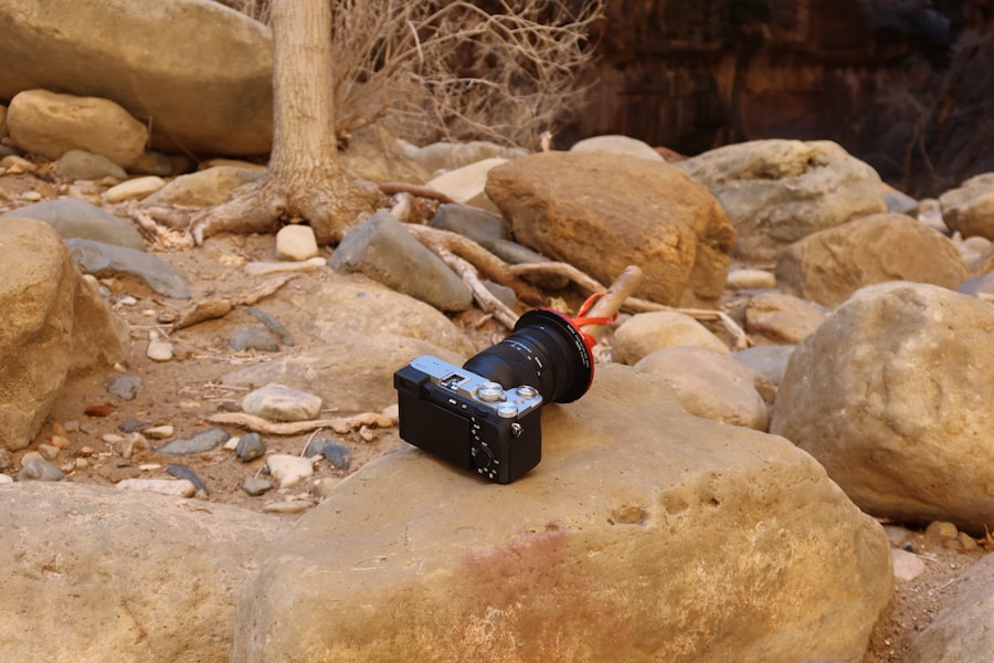 A camera rests on rocks in a wilderness area.