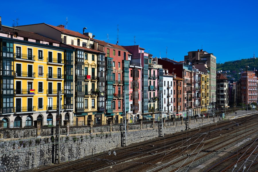 a row of buildings next to a train track