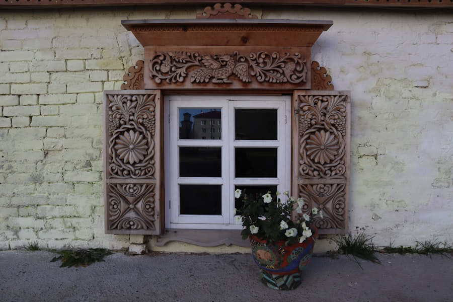 a flower pot sitting in front of a window