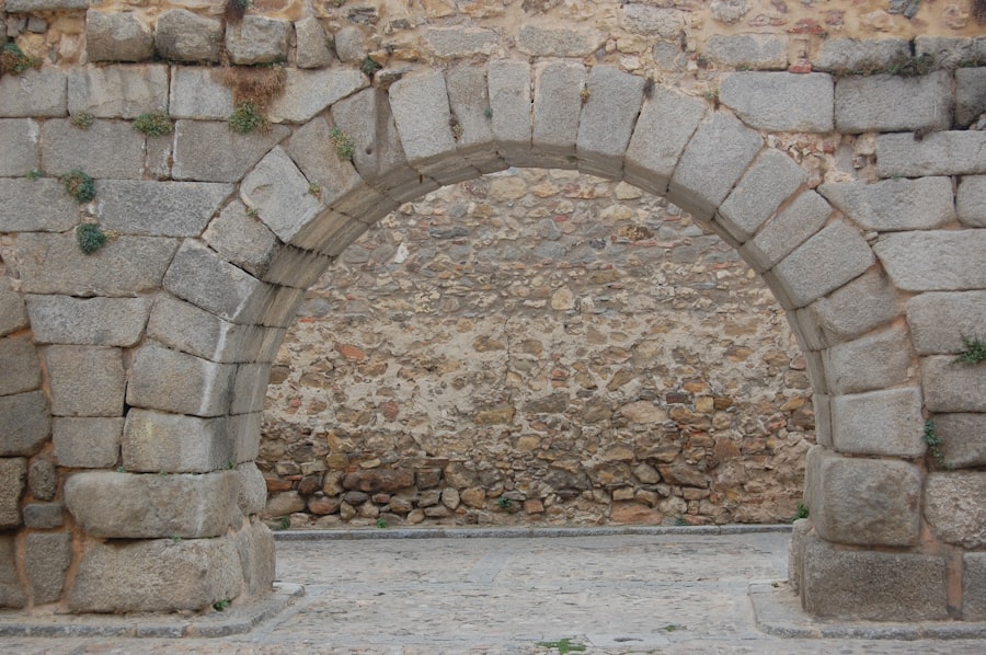 Stone archway leading to a textured wall