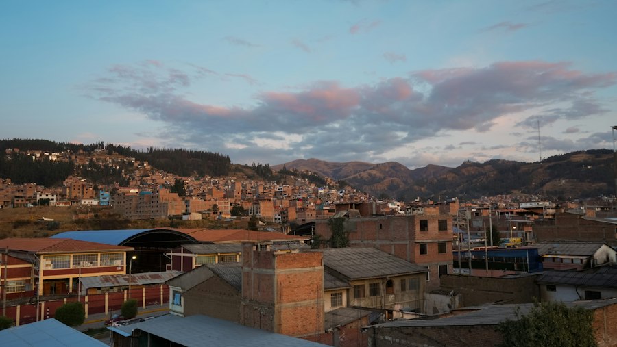 Cityscape with buildings on hillsides at dusk