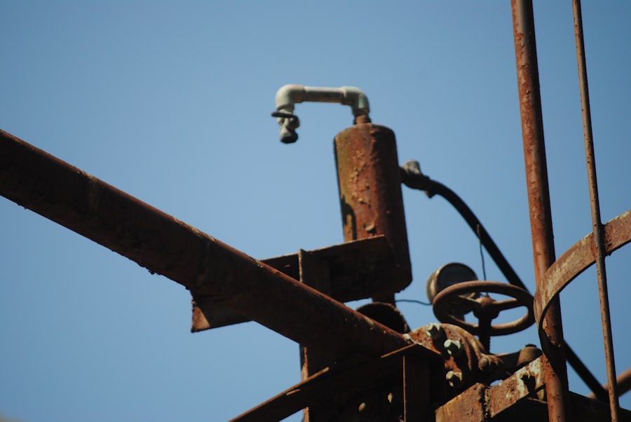 Rusty industrial machinery against a clear blue sky