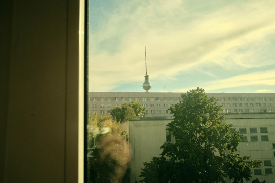 a view from a window of a building with a tv tower in the background