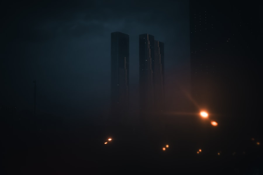 Tall buildings shrouded in fog at night