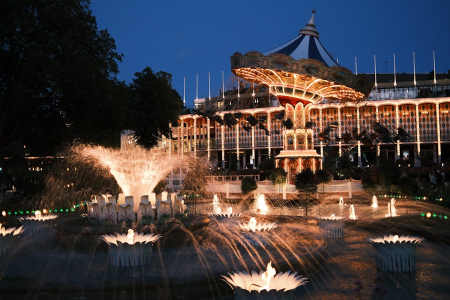 Amusement park with illuminated fountains at night