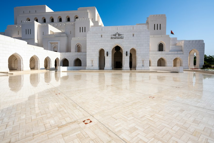 Modern white building with arches and courtyard