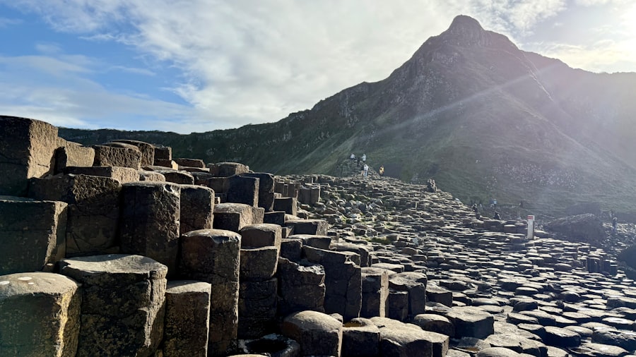 Hexagonal stone columns leading to a mountain peak.