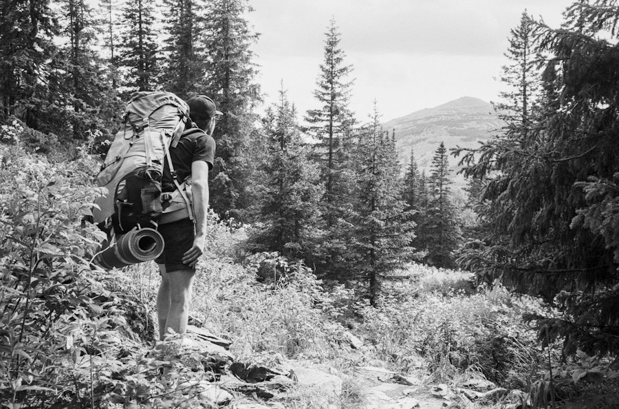 a person with a camera on a mountain