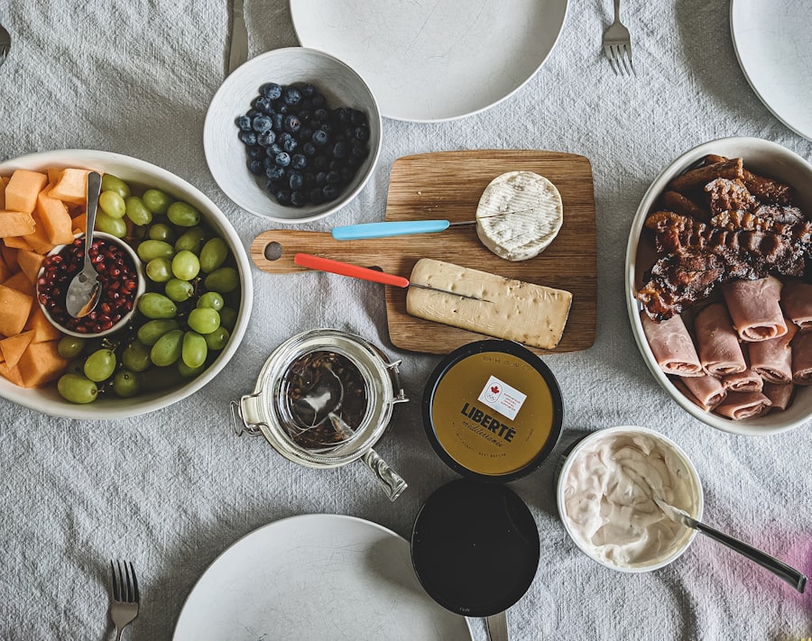 a table topped with plates and bowls of food