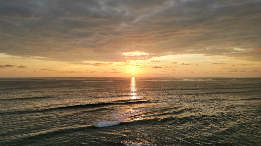 Golden sunset over the calm ocean waves