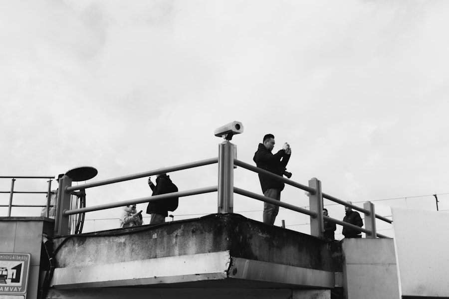 People on a balcony looking at the sky