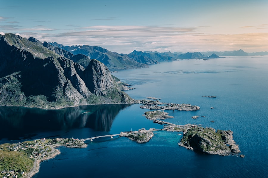 Coastal village nestled among dramatic mountains and blue water.