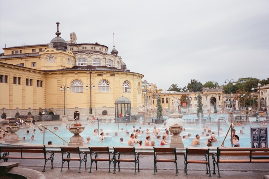 A group of people sitting around a swimming pool