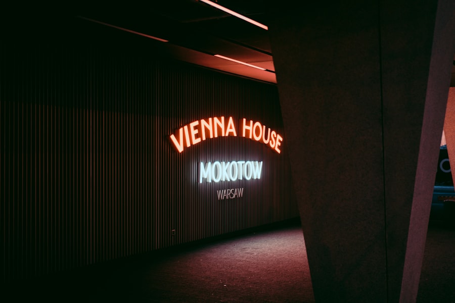 a neon sign is lit up in a dark room