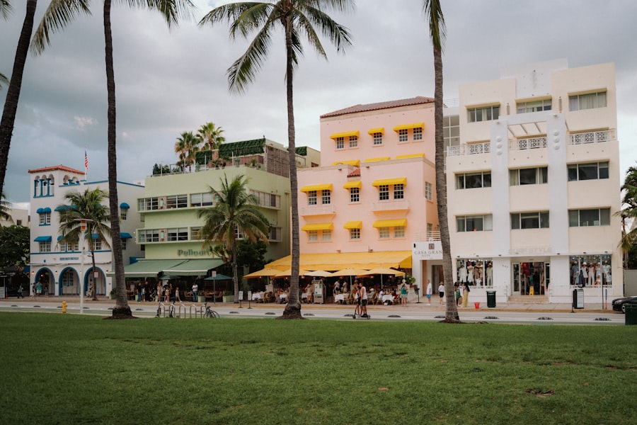 Colorful buildings and palm trees on a street.